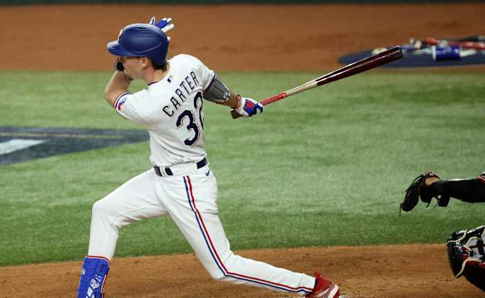 Oct 27, 2023; Arlington, TX, USA; Texas Rangers center fielder Evan Carter (32) hits a RBI double during the first inning in game one of the 2023 World Series against the Arizona Diamondbacks at Globe Life Field. Mandatory Credit: Kevin Jairaj-USA TODAY Sports
